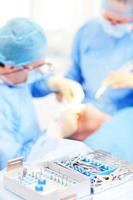 surgeons operating patient photo