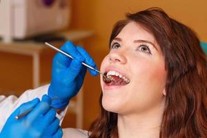Girl on examination at dentist photo