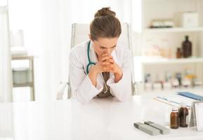 concerned medical doctor woman sitting in office