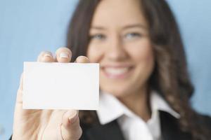 Businesswoman giving blank business card