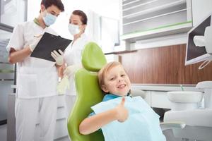 Cute male child is visiting dental doctor photo