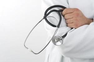 Close up of a doctor holding a stethoscope isolated photo