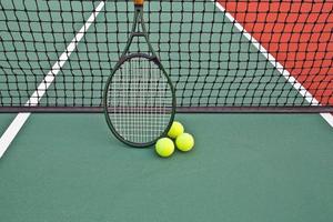 Tennis court with ball and racket photo