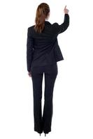 Corporate woman pointing at something photo
