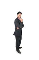 corporate portrait of young attractive businessman standing thoughtful photo