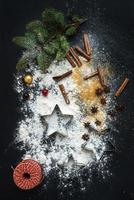 Baking ingredients for Christmas holiday traditional gingerbread cookies preparation, black photo