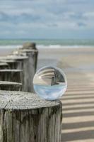 Groin at the sea with crystal ball
