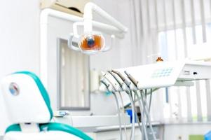 Close-up of dentist tools and equipment at dental clinic photo