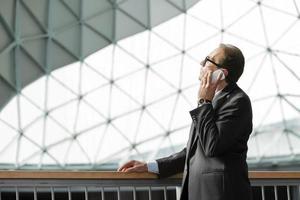 businessman in formal wear talking on phone photo