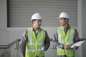 Two Asian industrial engineer's at work photo
