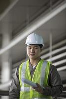 Asian industrial engineer at work photo