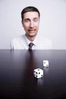 Business Man Gambling, Rolling Dice photo