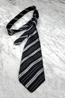 Striped tie on a marble table