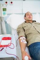 Male patient receiving a transfusion
