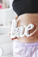 Pregnant Belly with word love