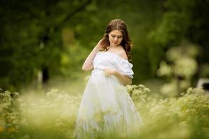 Pregnant woman in summer photo