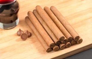 Worldwide famous hand rolled Cuban cigars with Red Wine