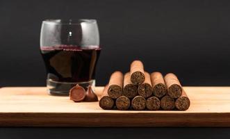 Worldwide famous hand rolled Cuban cigars with Red Wine