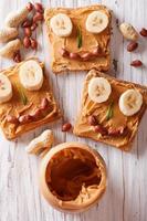 Sandwiches with peanut butter and banana for children photo