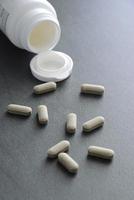 Pills on dark background photo
