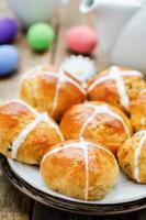 Easter buns with a cross and eggs photo