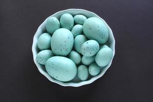 Easter eggs in white dish photo