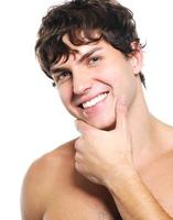 Face of a happy young man with health  clean skin photo