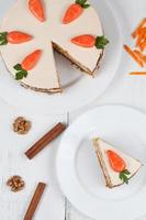 Tasty sliced easter carrot sponge cake with cream and little