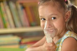 Lovely little girl with inhaler photo