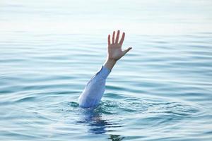 Hand of drowning man photo