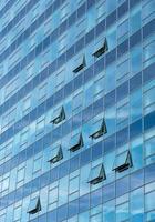 Architectural detail of a modern glass skyscraper building photo