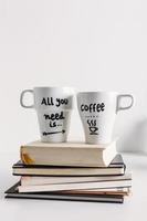 Two white coffee mug with diy decoration. photo