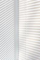 Venetian blinds background with sun light photo