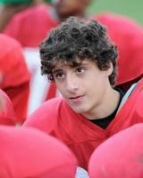 Football Player with Curly Hair