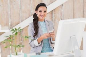 Stylish brunette working from home photo