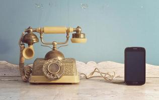 vintage telephone and smartphone.