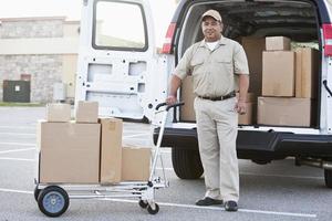 Hispanic man delivering packages photo