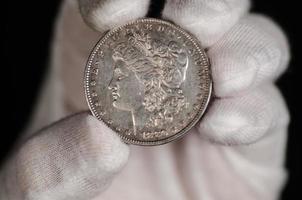 US Morgan Silver Dollar Coin Hand Held photo