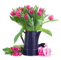 bouquet of pink tulips in blue pot photo
