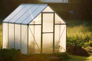 Small greenhouse in backyard photo