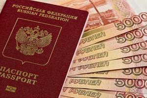 Russian passport and Russian banknotes photo