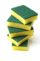 Stack of five yellow and green cleaning sponge pads