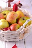 Fresh ripe apples in basket photo