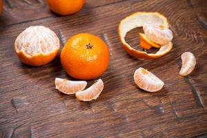 Tangerines on wooden table photo