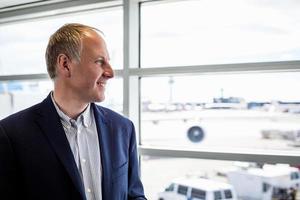 Businessman happy to travel by plane