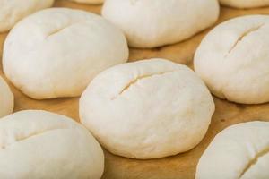 Full frame image of buns bread dough ready to bake photo