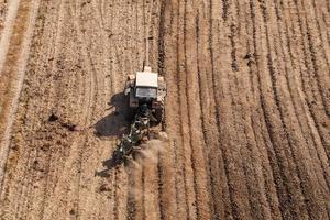 aerial view of tractor ploughing the field