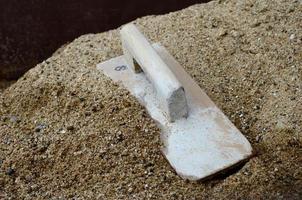 Plaster wood on sand photo