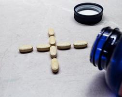 Vitamin and Mineral Pills/Tablets in a Plus/Positive Symbol
