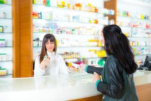 Pharmacist With Customer photo
